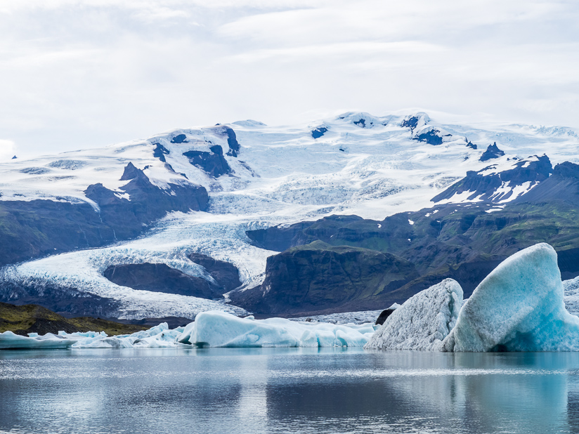 Icebergs calving at Fjallsarlon Glacier Lagoon, South Eastern Region